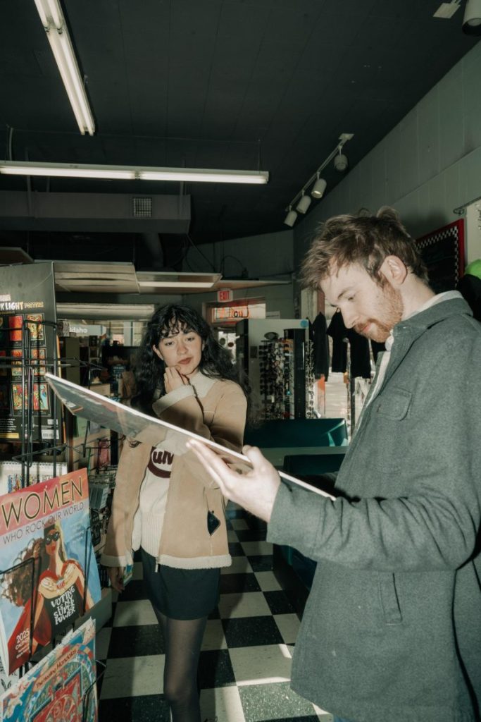 David and Ashley going through vinyls at The Record Exchange